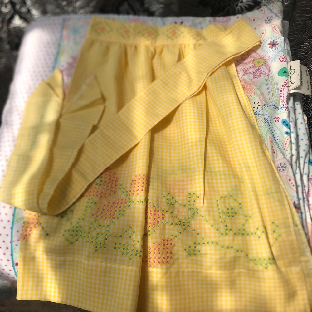 A beautiful Vintage handmade and hand stitched apron with pocket.